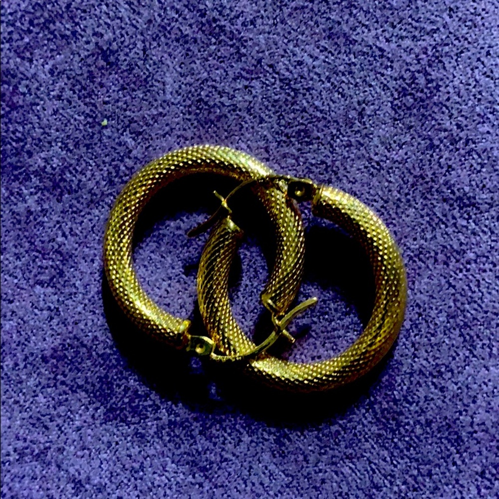 Gold earring hoops.
